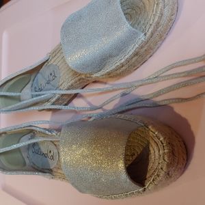 Shimmery pale gold espadrilles with tassel ties